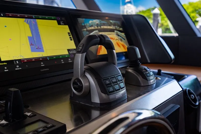 Snack Money Yacht Photos Pics Control panel of 2023 Bluegame BG 72 yacht with navigation screens and joystick.