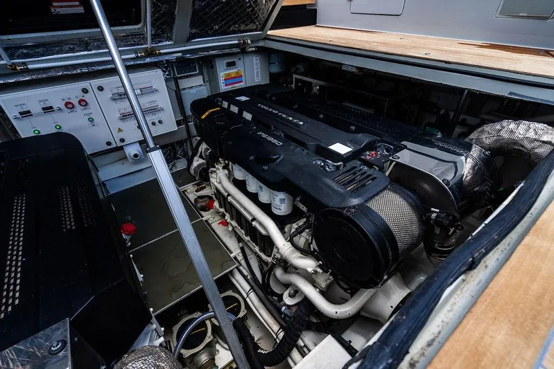 Snack Money Yacht Photos Pics Engine room of 2023 Bluegame BG 72 yacht, showcasing advanced machinery and control panels.