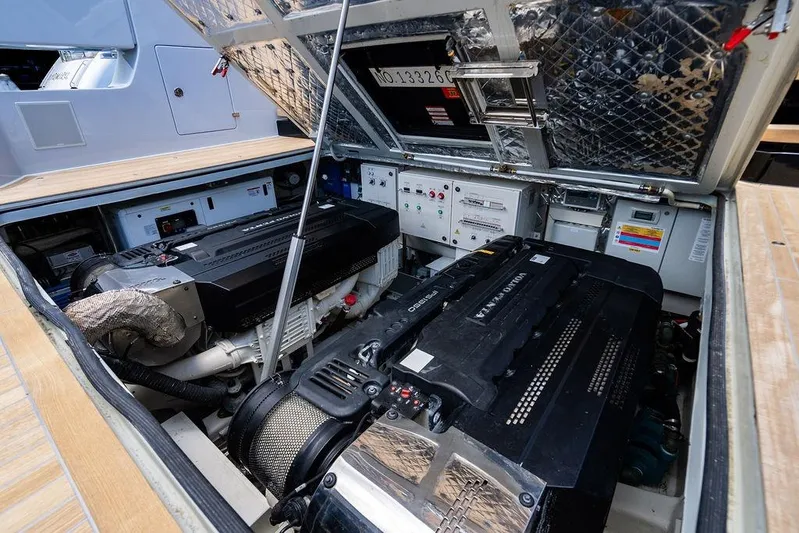 Snack Money Yacht Photos Pics Engine compartment of 2023 Bluegame BG 72 yacht, featuring Volvo Penta engines and control systems.