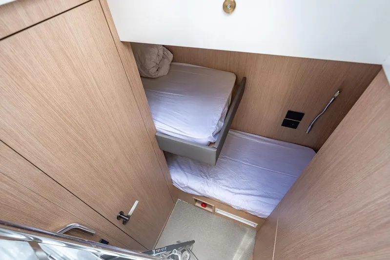 Snack Money Yacht Photos Pics 2023 Bluegame BG 72 yacht cabin with twin beds and modern wood finish.