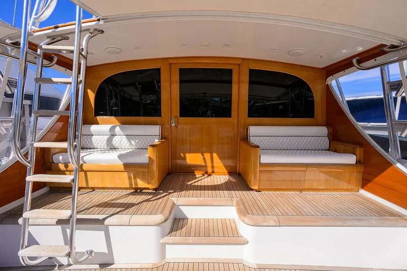 Ship's Cafe Yacht Photos Pics 1987 Merritt Boat Works Sport Fisherman with wooden deck and seating area.