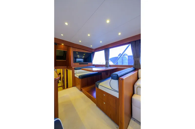 Ship's Cafe Yacht Photos Pics Interior of 1987 Merritt Boat Works Sport Fisherman with seating and window view.