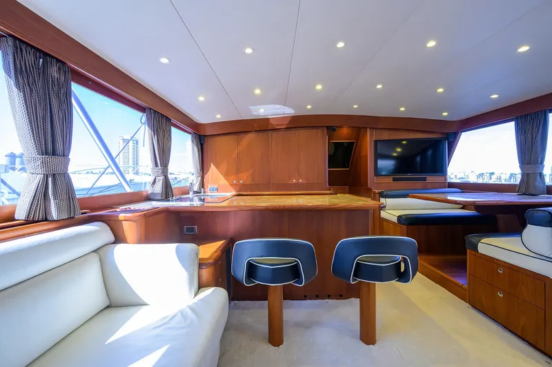 Ship's Cafe Yacht Photos Pics Luxurious 1987 Merritt Boat Works Sport Fisherman interior with elegant seating and wood finishes.