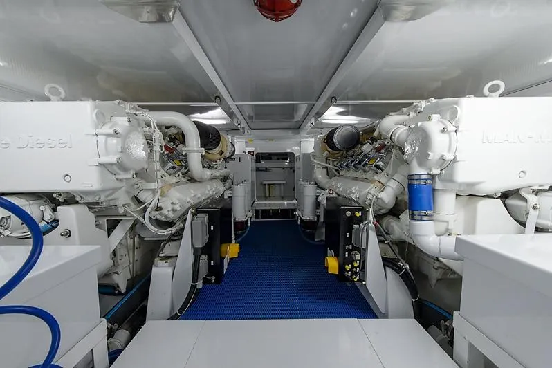 Ship's Cafe Yacht Photos Pics Engine room of a 1987 Merritt Boat Works Sport Fisherman, featuring dual marine diesel engines.