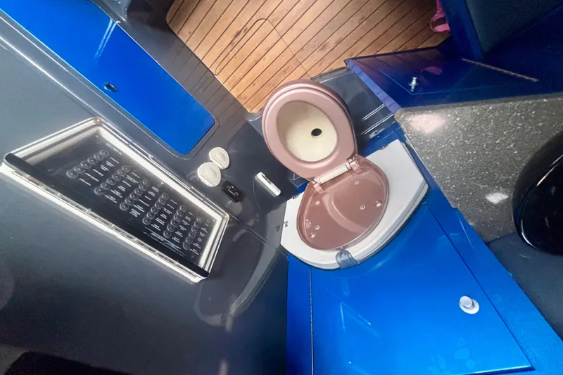  Yacht Photos Pics 2016 Hydra-Sports 4200 Siesta boat bathroom with modern fixtures and wooden accents.