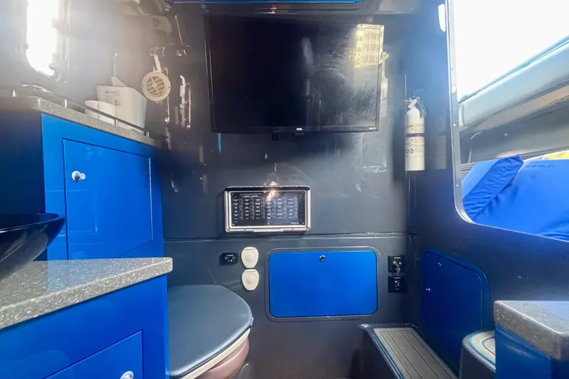  Yacht Photos Pics Interior of 2016 Hydra-Sports 4200 Siesta boat with blue cabinetry and modern amenities.