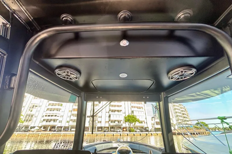  Yacht Photos Pics 2016 Hydra-Sports 4200 Siesta boat interior with speakers, cityscape view.