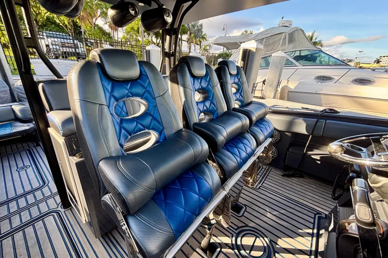  Yacht Photos Pics Luxurious interior of 2016 Hydra-Sports 4200 Siesta boat with blue leather seating.