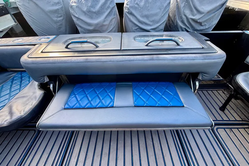  Yacht Photos Pics 2016 Hydra-Sports 4200 Siesta boat seating with blue quilted cushions and storage compartment.