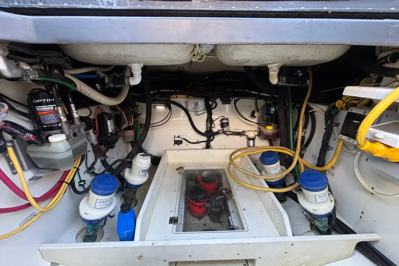  Yacht Photos Pics Engine compartment of a 2016 Hydra-Sports 4200 Siesta with visible hydraulic and fuel systems.