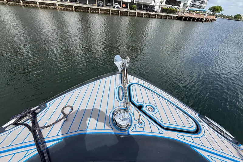  Yacht Photos Pics Bow view of 2016 Hydra-Sports 4200 Siesta boat on calm water near a dock.