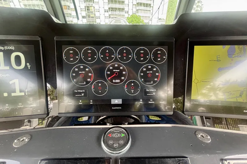  Yacht Photos Pics Dashboard of a 2016 Hydra-Sports 4200 Siesta with Garmin navigation displays.