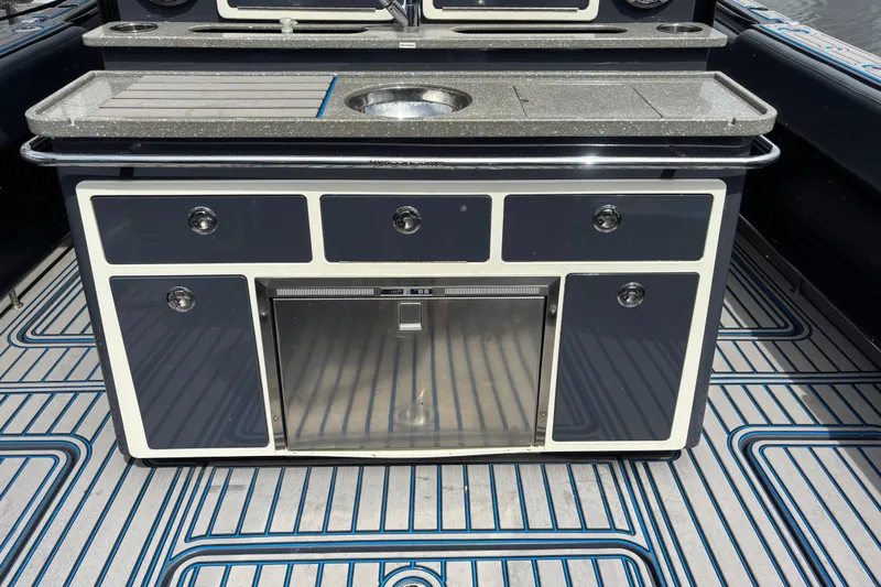  Yacht Photos Pics 2016 Hydra-Sports 4200 Siesta boat kitchen with sleek countertop and storage cabinets.