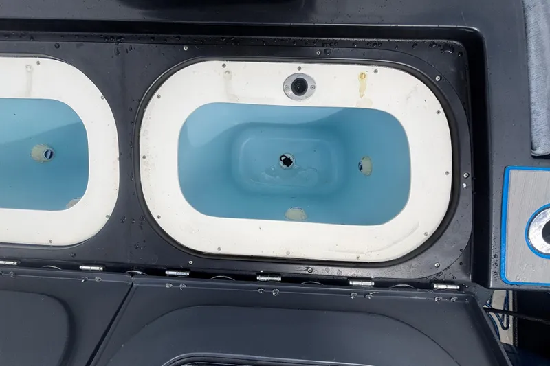  Yacht Photos Pics Livewell compartments on a 2016 Hydra-Sports 4200 Siesta boat, featuring blue interiors.