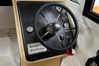 Steering console of 2022 Flexboat FLEX 680 EXPLORE with wooden flooring.