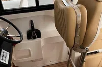 2022 Flexboat FLEX 680 EXPLORE interior with beige seating and steering wheel.