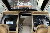 Interior of 2022 Flexboat FLEX 680 EXPLORE, featuring modern dashboard and steering wheel.