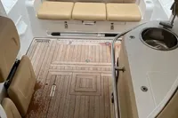 2022 Flexboat FLEX 680 EXPLORE interior with beige seating and wooden deck.