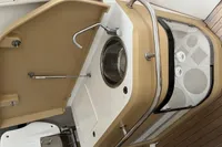 Compact kitchenette on 2022 Flexboat FLEX 680 EXPLORE with sink and storage.