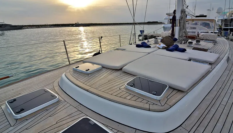 Wind Of Change Yacht Photos Pics 1988 Motorsailer Brooke Marine yacht deck at sunset with sun loungers.