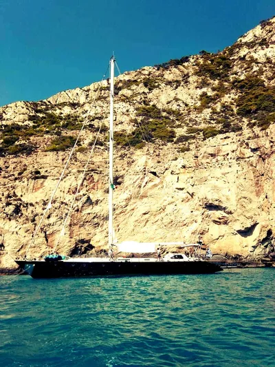 Wind Of Change Yacht Photos Pics 1988 Motorsailer Brooke Marine yacht anchored near rocky coastline