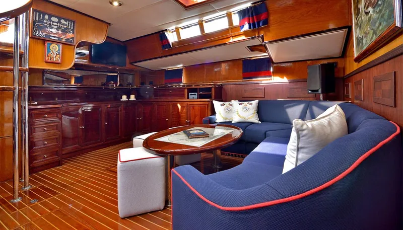 Wind Of Change Yacht Photos Pics Luxurious 1988 Brooke Marine Motorsailer interior with elegant wood finishes and cozy seating area.