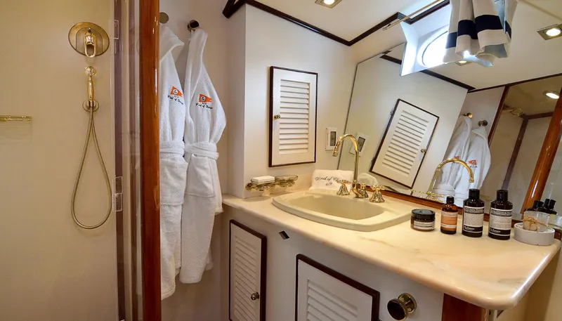 Wind Of Change Yacht Photos Pics Luxurious bathroom in a 1988 Motorsailer Brooke Marine yacht with elegant fixtures and amenities.