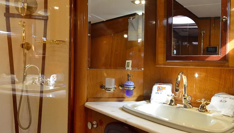 Wind Of Change Yacht Photos Pics Luxurious bathroom in a 1988 Motorsailer Brooke Marine yacht with wooden finishes.