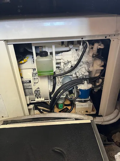 One In A Million Yacht Photos Pics Engine compartment of a 2005 Carver 444 boat, featuring Kohler power systems.