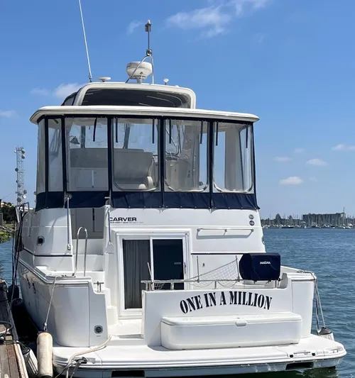 One In A Million Yacht Photos Pics 2005 Carver 444 yacht named "One in a Million" docked by the water.