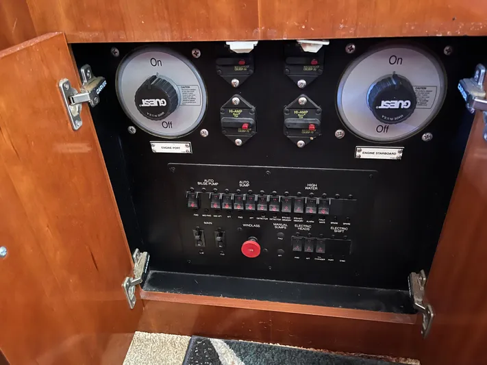One In A Million Yacht Photos Pics Electrical control panel inside a 2005 Carver 444 boat, featuring switches and circuit breakers.