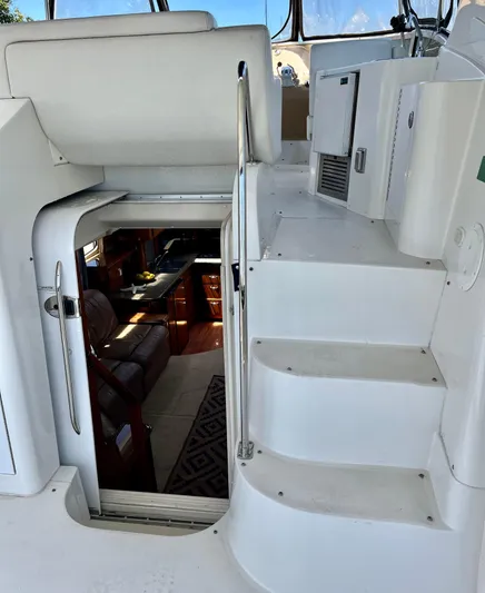 One In A Million Yacht Photos Pics Interior view of 2005 Carver 444 yacht, showing stairs and cabin entrance.