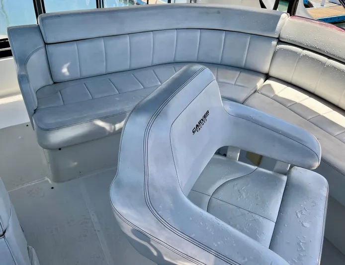 One In A Million Yacht Photos Pics 2005 Carver 444 yacht interior with light blue seating and water droplets.