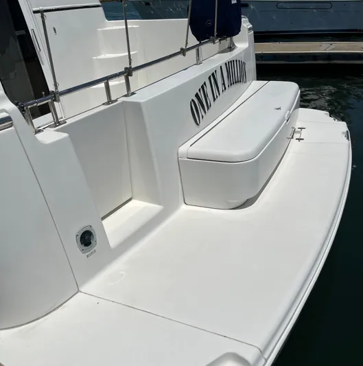 One In A Million Yacht Photos Pics 2005 Carver 444 yacht stern with "One in a Million" text, docked at marina.