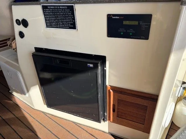 Rhode Waves Yacht Photos Pics Interior of 2018 Eastern 27 Islander Hardback with refrigerator.