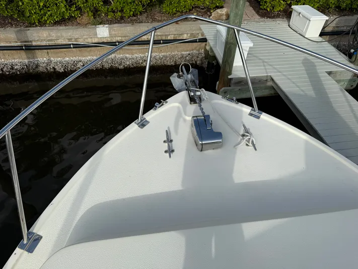 Rhode Waves Yacht Photos Pics Bow of a 2018 Eastern 27 Islander Hardback boat at dock.