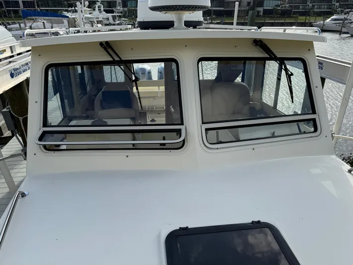 Rhode Waves Yacht Photos Pics 2018 Eastern 27 Islander Hardback boat at dock.