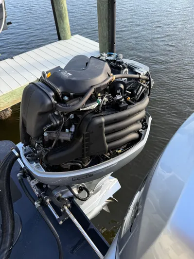 Rhode Waves Yacht Photos Pics Outboard motor of a 2018 Eastern 27 Islander Hardback at dock.
