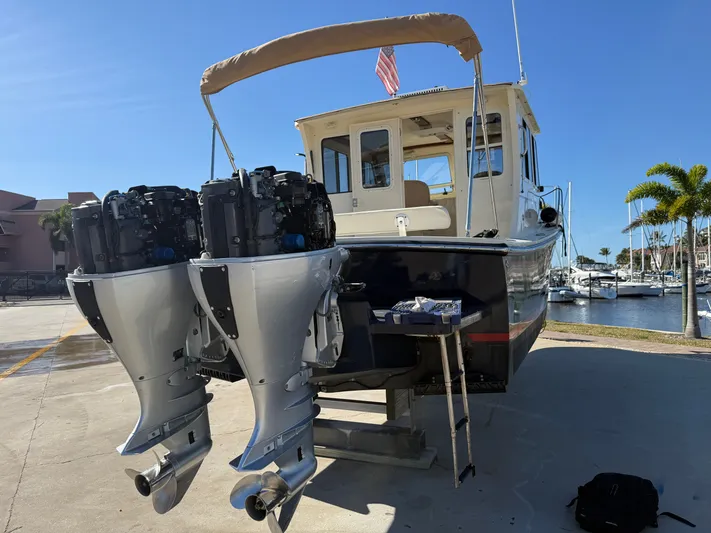 Rhode Waves Yacht Photos Pics 2018 Eastern 27 Islander Hardback with twin outboard motors at the marina.