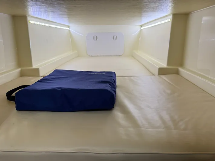 Rhode Waves Yacht Photos Pics Interior of 2018 Eastern 27 Islander Hardback with blue cushion.