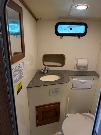 Rhode Waves Yacht Photos Pics Interior view of bathroom on a 2018 Eastern 27 Islander Hardback boat.