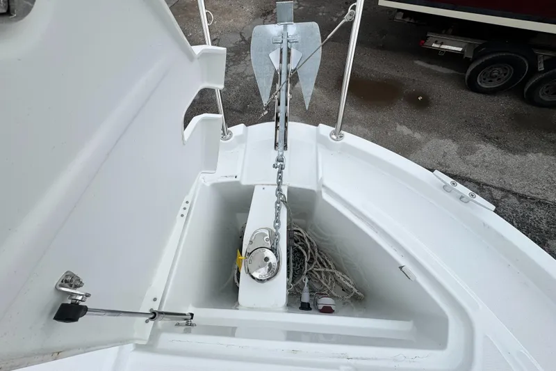  Yacht Photos Pics Anchor compartment of 2025 Beneteau Antares 8 boat, featuring anchor and rope storage.