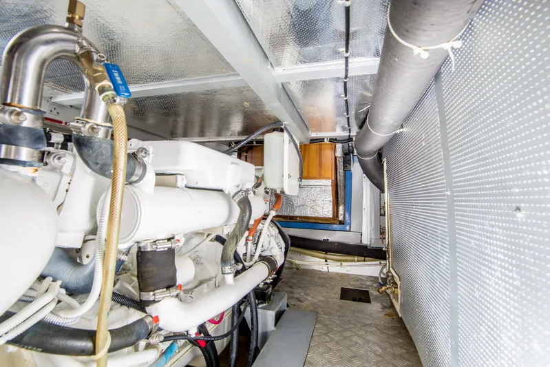 Papagayo Yacht Photos Pics Engine room of 2008 North Pacific 43 Pilothouse, showcasing mechanical components and piping.