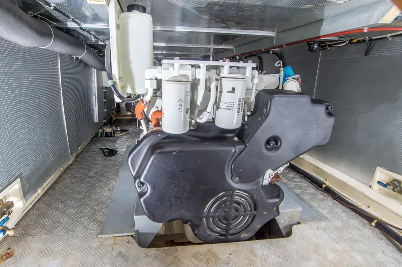 Papagayo Yacht Photos Pics Engine room of 2008 North Pacific 43 Pilothouse boat, showcasing machinery and components.