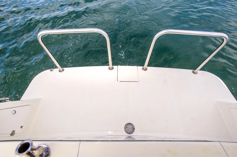 Papagayo Yacht Photos Pics Swim platform of 2008 North Pacific 43 Pilothouse boat with stainless steel railings.