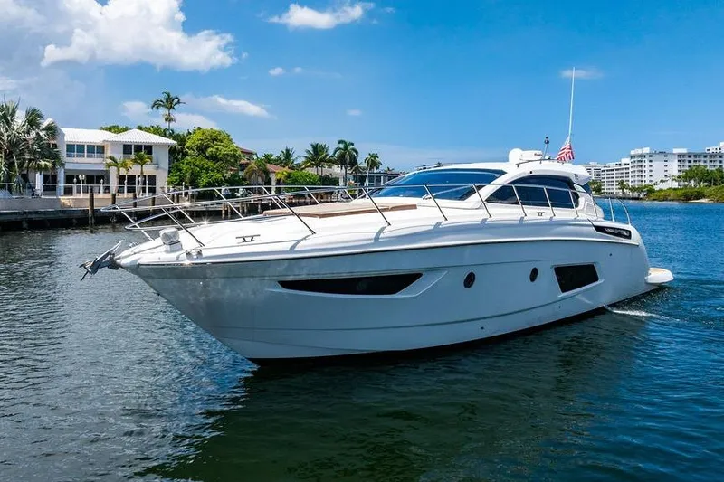 Endurance Yacht Photos Pics 2016 Azimut Atlantis 50 yacht cruising on a sunny day near waterfront homes.