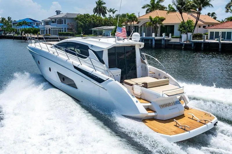 Endurance Yacht Photos Pics Luxury 2016 Azimut Atlantis 50 yacht cruising on a sunny waterfront.