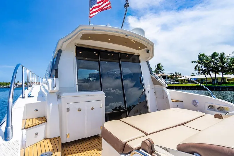 Endurance Yacht Photos Pics Azimut Atlantis 50 yacht, 2016 model, docked with luxurious deck and American flag.
