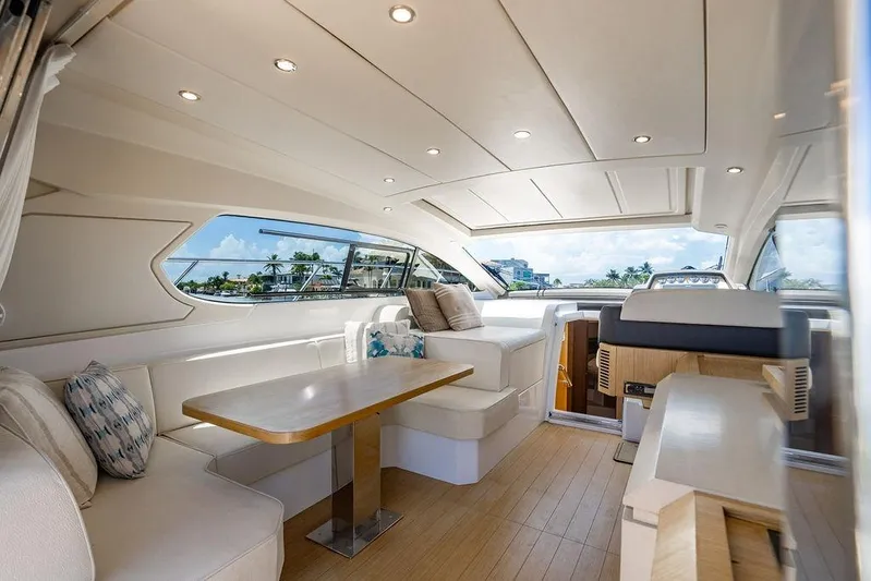 Endurance Yacht Photos Pics Luxurious interior of 2016 Azimut Atlantis 50 yacht with elegant seating and panoramic windows.