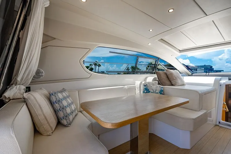 Endurance Yacht Photos Pics Luxurious interior of 2016 Azimut Atlantis 50 yacht with elegant seating and scenic window view.